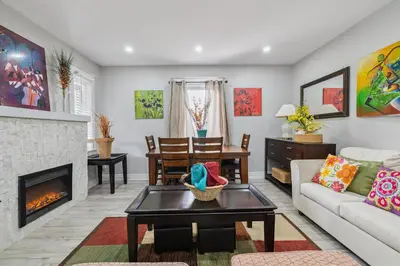 a living room with a couch and a fireplace at Ora's Place BNB in Niagara Falls