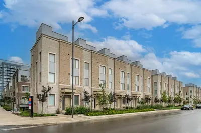 a large brick building on a city street at Luxury Townhouse in Vaughan in Vaughan