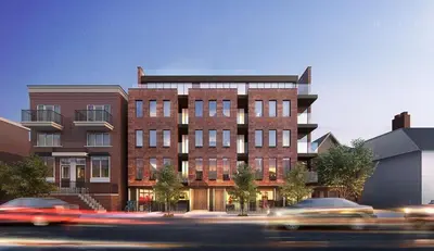 a tall brick building with cars in front of it at Peaceful 2BR Basement Suite Near Downtown Toronto - The Roland in Toronto