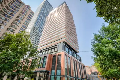 a tall building in a city with tall buildings at Downtown 1BR City Stay with Balcony and Fast Wi-Fi in Toronto