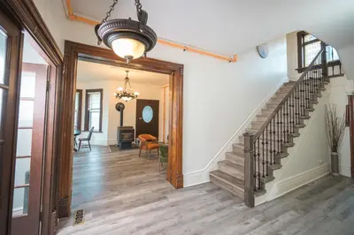 a hallway with a staircase in a house at Comic House with Climbing Wall & Themes in Chesley
