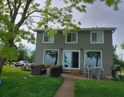a house with a couch and chairs in the yard at 5 o clock somewhere in Hamilton
