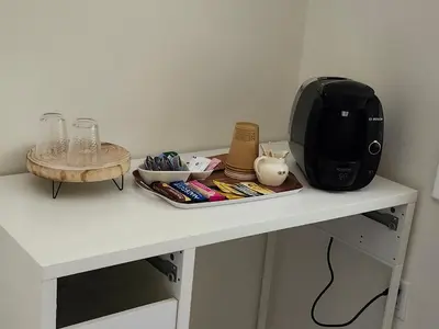 a microwave sitting on top of a white table at 3Q Ltd in Hamilton