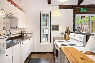 a kitchen with a sink and a stove top oven at Margaritaville - Big Space with Lots of fun and Hot Tub 38R in Blue Mountains