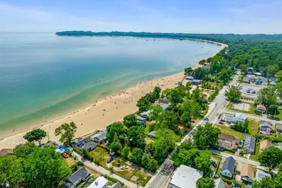 an aerial view of a beach and the ocean at Crystal Tides Retreat in Fort Erie