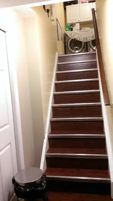 a staircase in a house with a washing machine at HB Guest Home in Waterloo