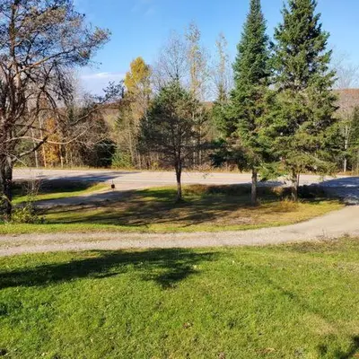 a park with trees and a path in the grass at Our Happy Place in Wilberforce