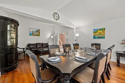 a dining room with a table and chairs at The Wilcox Villa in Mississauga