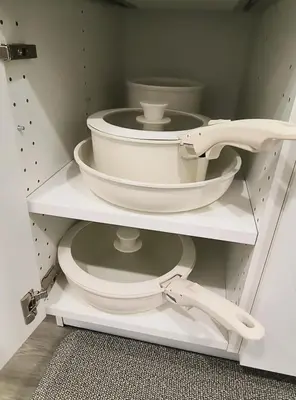 a white toilet sitting in a white cabinet at ArbyManie's Place Newly Built Basement Apartment in London