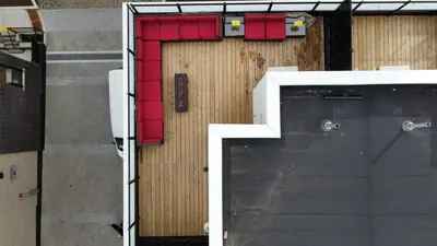 a building with a door with red dividers on it at Modern Townhouse Rooftop Vibes in Oakville