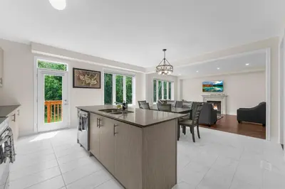 an open kitchen and living room with a dining room at Heaven Beach House 2 min walk in Georgina