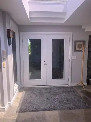 a room with a white door with glass at Fieldstone & Sky in Frankford