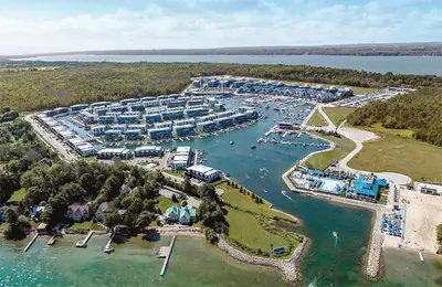 an aerial view of a resort on the water at Central & Cozy 2BR Townhome with Free Parking, WiFi, Full Kitchen, Laundry, Steps to Strip Plaza & 5 Min Drive to Innisfil Beach Park! Perfect for Work Trips, Family Travel & Couples! in Innisfil
