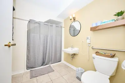 a bathroom with a toilet and a sink at Nine Vines Hotel in Niagara on the Lake