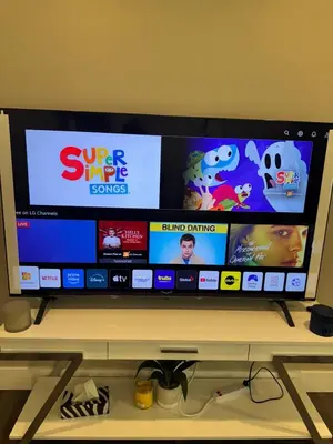 a flat screen tv sitting on top of a shelf at Luxe Living Prime Location in Kitchener