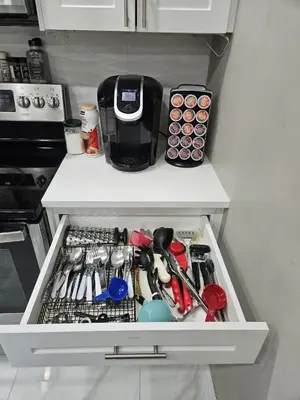 a drawer in a refrigerator filled with cooking utensils at Beautiful 3 bedrooms, 2 bathrooms, 4 beds sleep 8, basement close to Falls in Niagara Falls