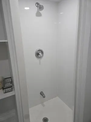 a shower with two faucets in a bathroom at One Bed basement Room in Brampton