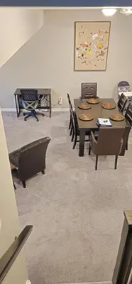 a room with a table and chairs and a painting at 3BR Townhome Wright Dr Midland Near Little Lake in Midland