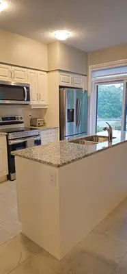 a kitchen with a counter top and a sink at 3BR Townhome Wright Dr Midland Near Little Lake in Midland