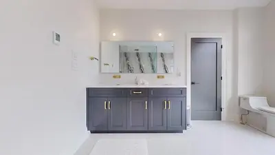 a bathroom with a sink and a mirror at Lucky Mansion - a Luxury Villa in Fort Erie ! in Fort Erie