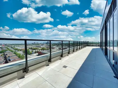 a balcony of a building with a view of the city at The Panorama Penthouse - 180 Views and Free Parking by Instant Suites in Toronto