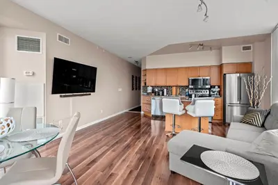 a living room with a couch and a table at Downtown Condo with Picturesque View in Toronto
