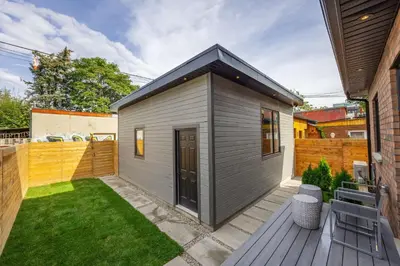 a small gray house with a small backyard at Prestige 3BR Luxury Living in Queen West in Toronto