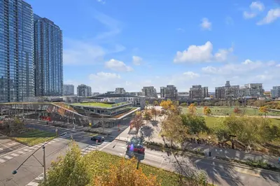 a view of a city with tall buildings and a street at Spacious Retreat Luxe 3BR Condo with City Views in Toronto
