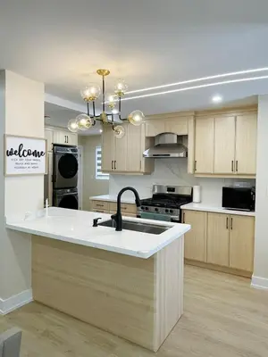 a kitchen with a sink and a stove at 3 Bedroom Home Peaceful & Trendy in Brampton