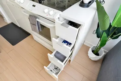 a kitchen with a white counter with a plant at Modern Waterfront Comfort Condo with City Views in Toronto