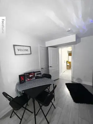 a dining room with a table and chairs at Entire unit seprate entrance in Richmond Hill