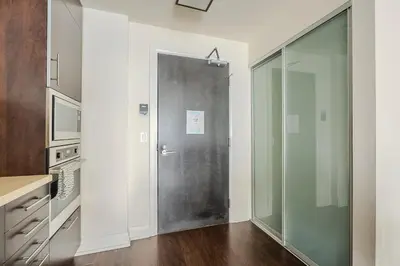 a bathroom with a glass door in a kitchen at Modern 2Bd 2Ba Skyscraper Free parking in Toronto