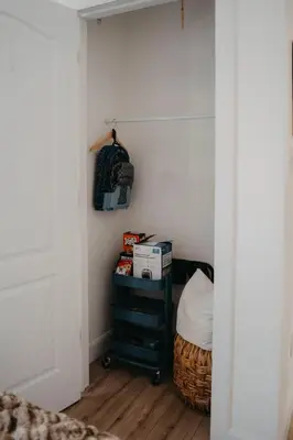 a room with a closet with a bed and a table at The Hideout in Barrie