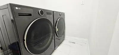 a washer and dryer sitting next to each other at Muskoka Luxury Getaway in Gravenhurst