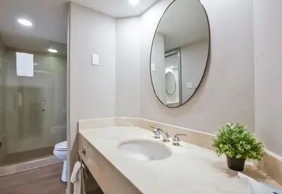 a bathroom with a sink and a mirror at Perfect Jacuzzi Suite at Highland in Shanty Bay