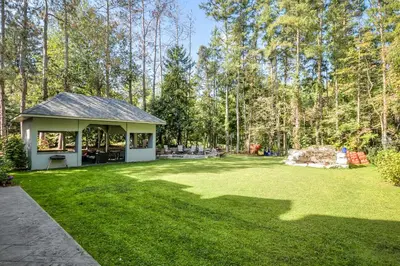 a yard with a pavilion in the middle at Private Oasis in King City in King City