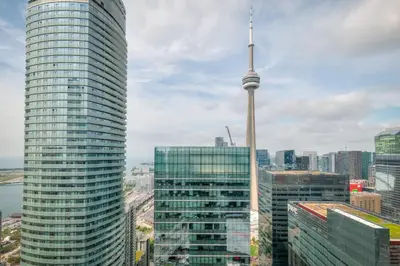 a view of the cn tower and buildings in a city at Down Town CN Tower View 2BR Condo with Balcony and WiFi in Toronto