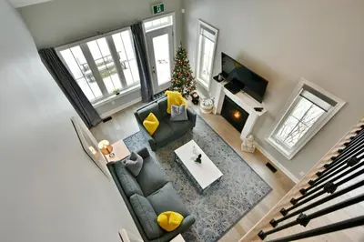 an overhead view of a living room with a christmas tree at Blue Mountain Village Townhome 4 Bedroom with Shuttle & Pool in Blue Mountains