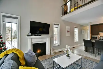 a living room with a christmas tree and a fireplace at Blue Mountain Village Townhome 4 Bedroom with Shuttle & Pool in Blue Mountains