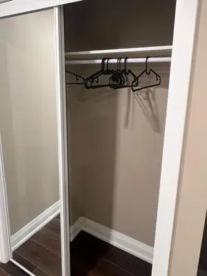a closet door with a hanger in it at Bright & Cozy Bankfield Stay in Toronto