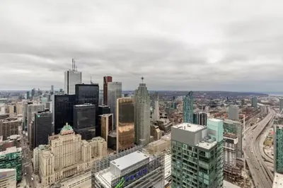 an aerial view of a city with skyscrapers at Sunshiny 1 BD 61st Floor Outstanding View in Toronto