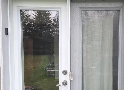 a white door with a view of a yard at Century House on Quarter acre lot in Acton