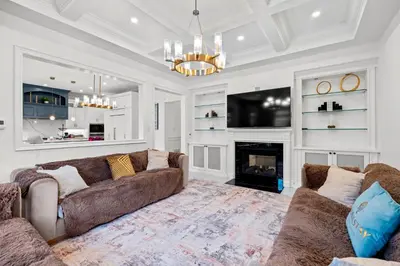 a living room with a couch and a fireplace at GlobalStay Luxury 4 Bedroom House Wonderland Vaughan in Vaughan