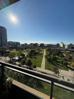 a view of a park from the balcony of a building at Spectacular Large 3 Bedroom 3 Bath Condo Downtown Toronto Lakeview in Toronto