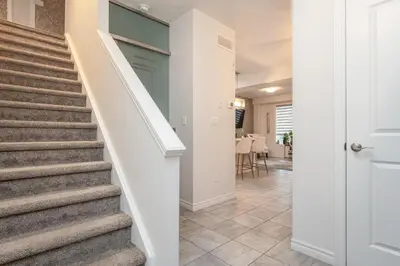 a hallway with stairs in a home with a door at Comfy 3 Bed woodstock Escape in Woodstock