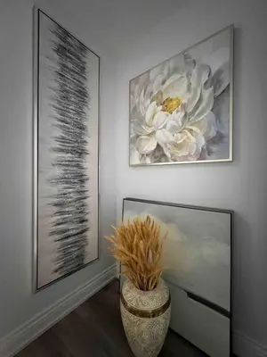 a room with two pictures on the wall and a vase at Elegant Oakville Town Residece in Oakville