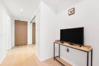 a living room with a flat screen tv on a table at 251 Jarvis st -Steps to Eaton Centre - Monthly Stays Only in Toronto