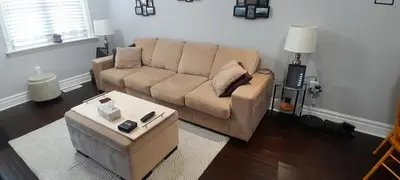a living room with a couch and a coffee table at The Cozy Bungalow in North York Nest in Toronto
