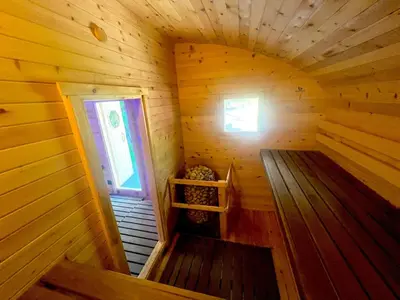 an inside view of a wooden cabin with a window at Hot Tub BANYA Sauna True Cottage experience in Innisfil
