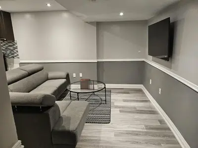 a living room with a couch and a table at 1 BR Bsmt, Sep Entrn, Fre Prkn, Wi-Fi, Ktchn, Lndry in Mississauga